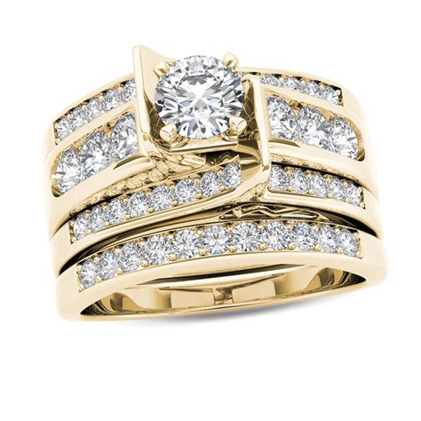 Fashioned in warm 14K gold Four princess-cut diamonds sparkle at the center of the engagement ring. . Zales bridal set